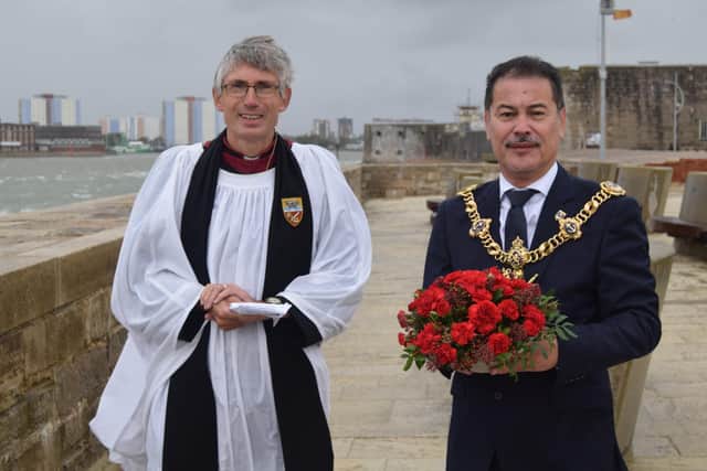 Lord Mayor of Portsmouth Councillor Rob Wood, with the wreath, pictured next to the Very Revd Dr Anthony Cane, Dean of Portsmouth. Photo: Tom Cotterill