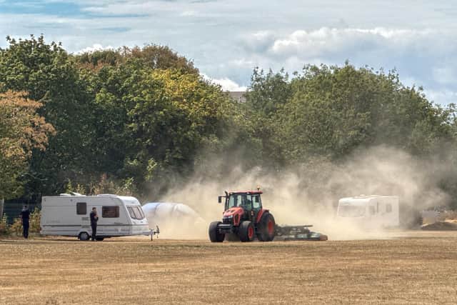 Travellers get a dusty welcome at a field in Rowner, Gosport on Monday. Gosport council vehicles surrounded the area shortly after the first caravans arrived to block further access.