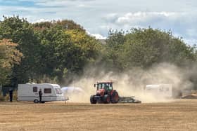 Travellers get a dusty welcome at a field in Rowner, Gosport on Monday. Gosport council vehicles surrounded the area shortly after the first caravans arrived to block further access.
