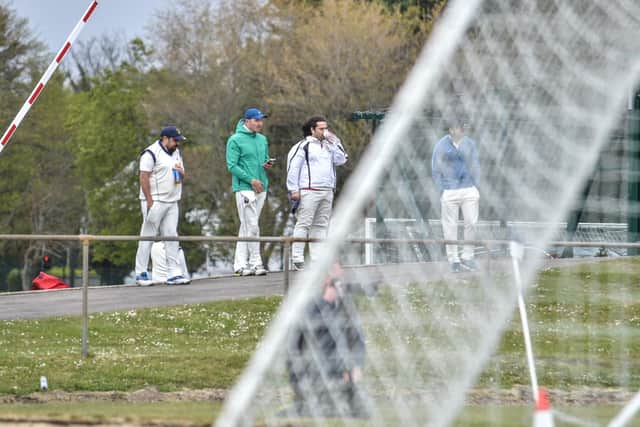 Cricketers watch the US Portsmouth v Binfield FA Vase tie. Picture: Daniel Haswell.