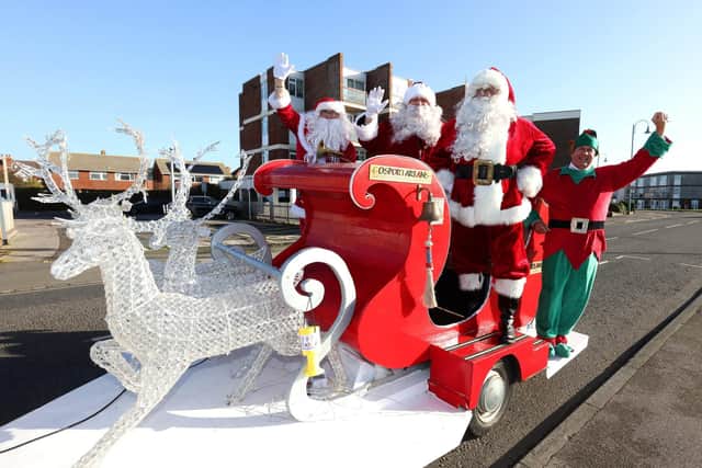 Malcolm Dent the Head Elf pictured with some of the volunteer Santas, (Paul Shortt, Rob Monday and David Bates) who man the Gosportarians sleigh every night during the run up to Christmas.
Picture: Sam Stephenson
