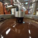 A picture shows hot chocolate before being moulded at the Barry Callebaut chocolate factory in Wieze, Belgium. Picture: GEORGES GOBET/AFP via Getty Images.