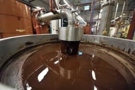 A picture shows hot chocolate before being moulded at the Barry Callebaut chocolate factory in Wieze, Belgium. Picture: GEORGES GOBET/AFP via Getty Images.