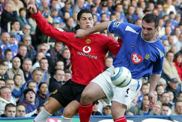 David Unsworth challenges Cristiano Ronaldo in Pompey's 2-0 win over Manchester United in October 2004. Picture: Matthew Peters/Manchester United via Getty Images