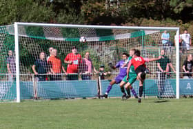 Callum Benfield heads Fareham Town's FA Cup consolation at Blackfield. Picture by Ken Walker.