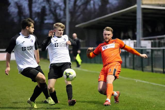 AFC Stoneham (white) in action during their win at AFC Portchester in January. Picture: Chris Moorhouse
