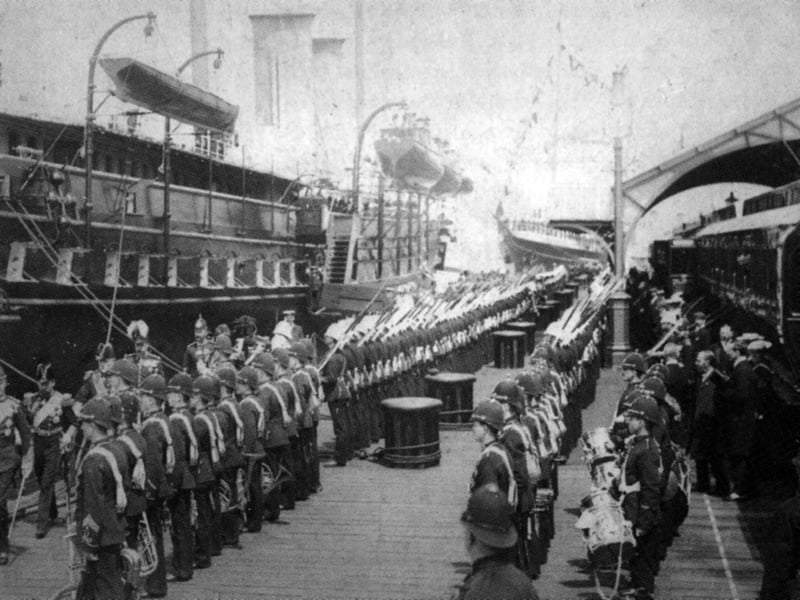 RY Victoria and Albert III.
Pictured is: Victoria and Albert alongside South Railway Jetty, Portsmouth Dockyard in 1906 when the Royal Family returned from a cruise in the Mediterranean. To the right is the Royal Train awaiting to take the party back to London via the viaduct across the harbour mudflats. The shelter has since been moved further north and around a corner to the right.