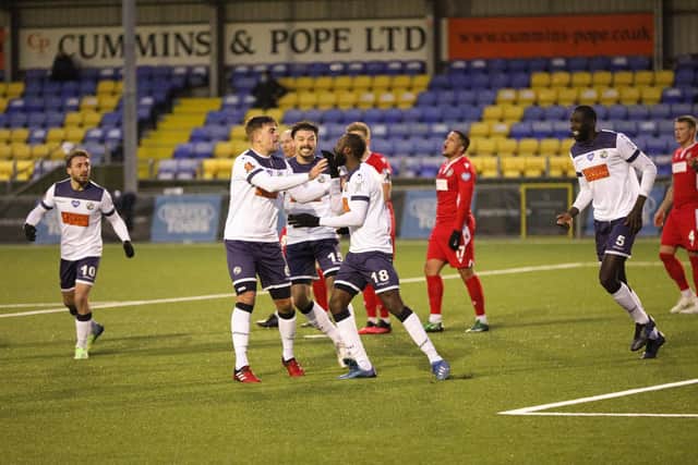 Bedsente Gomis (right of middle three) has just restored Hawks' lead in their 4-2 home win against Hungerford. Picture: Chris Moorhouse