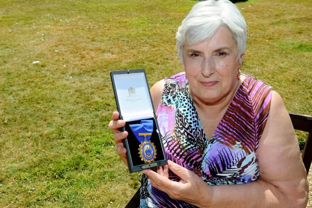 Sylvia Simmons, 70, with her Royal College of Nursing Award of Merit. Picture: Sarah Standing (180544-8527)