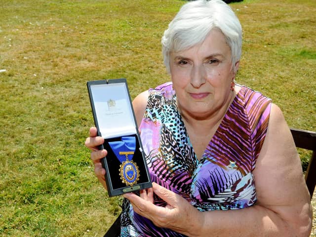 Sylvia Simmons, 70,  with her Royal College of Nursing Award of Merit. Picture: Sarah Standing (180544-8527)