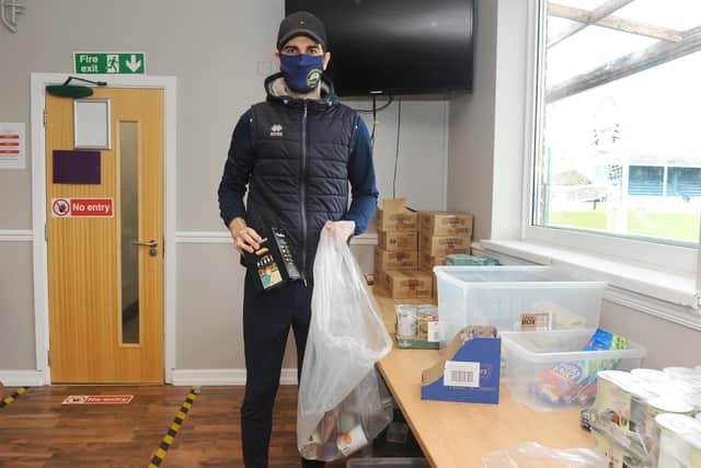 Matt Paterson packing some of the food parcels at Privett Park. Picture: Sarah Standing