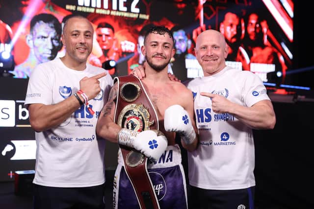 Mikey McKinson, centre, with trainer and father Michael Ballingall, left, and fellow team member Gav Jones. Picture: Mark Robinson/Matchroom Boxing