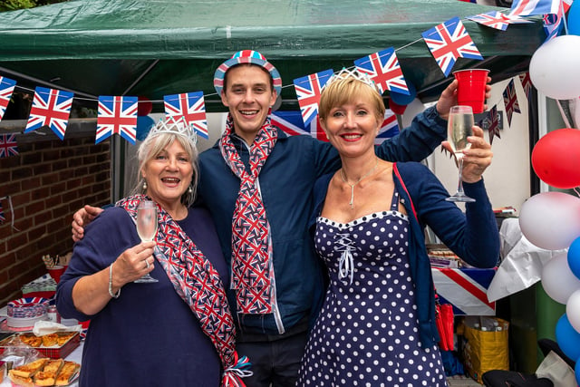 Residents at the Duncan Road jubilee street party. Pictured: Teri Kirk (56), Sean Lynch (28) and Kathleen Rutter (57). Picture: Mike Cooter (050622)