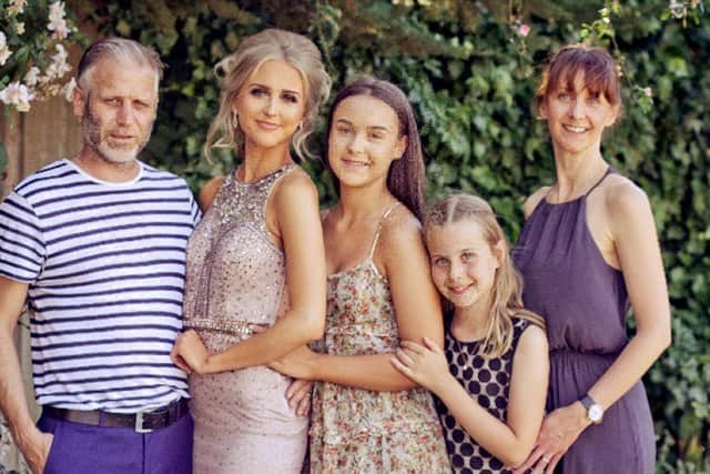 Carly and Glenn with their three daughters.