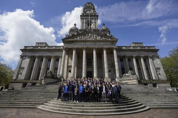 Member of Portsmouth FC, city dignitaries and volunteers on  the steps of Portsmouth Guildhall before a civic reception to mark the club's successful 125th anniversary season. Picture by Jason Brown