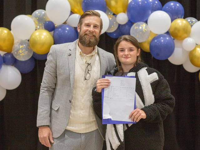 Head teacher Ashley Howard with Roxy as she celebrates her GCSE results at Mayfield School, PortsmouthPicture: Habibur Rahman