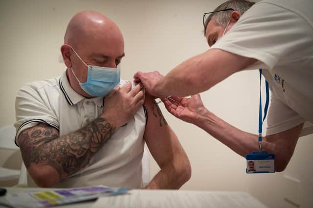 A man gets vaccinated at Gunwharf Quays on January 29, 2022 in Portsmouth. Picture: Finnbarr Webster/Getty Images.