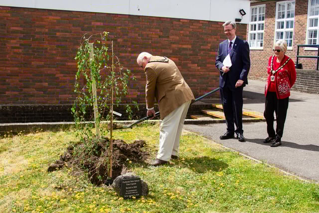 Mayor Councillor Peter Wade planting a tree to commemorate the school's 100th anniversary