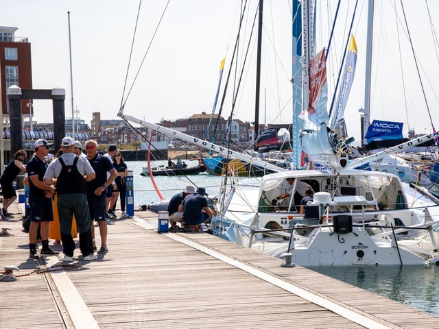 The calm before the storm. Sailors make last minute preparations before the race begins again.