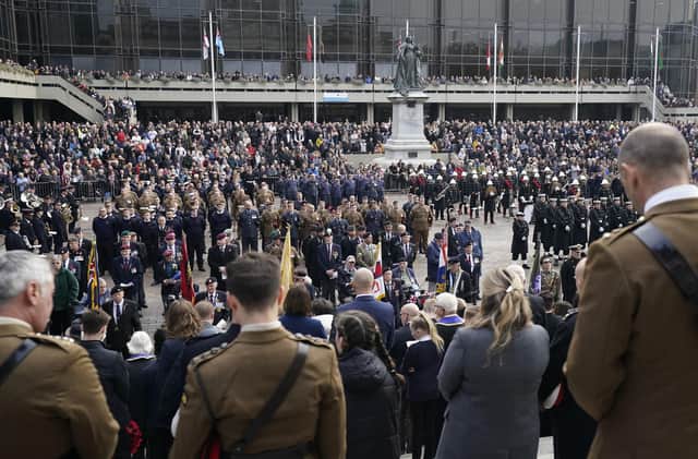 Members of the public, veterans and members of the armed forces take part in a Remembrance Sunday service and parade in Guildhall Square in Portsmouth. Picture: Andrew Matthews/PA Wire