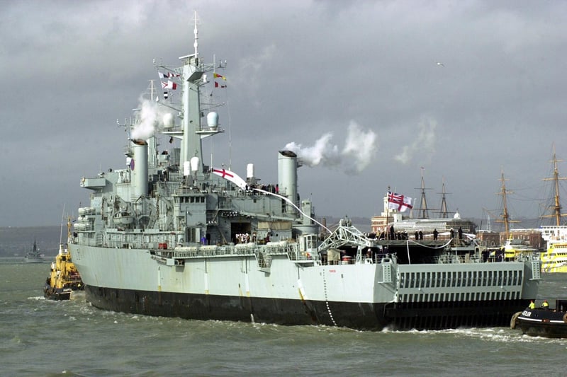 HMS Fearless enters Portsmouth flying her paying off pennant.