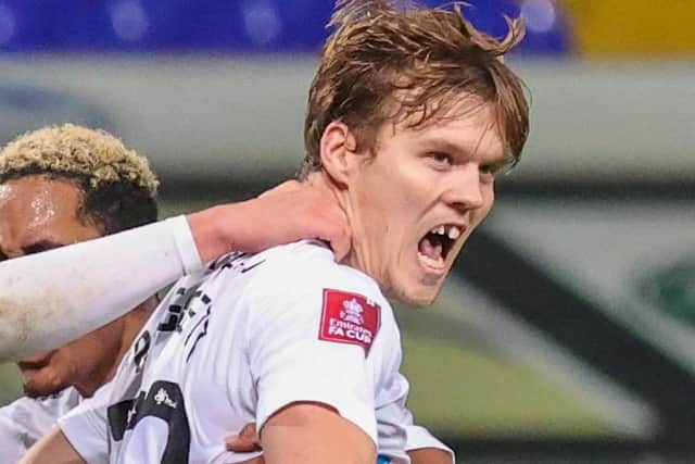 Sean Raggett celebrates his winner on Saturday