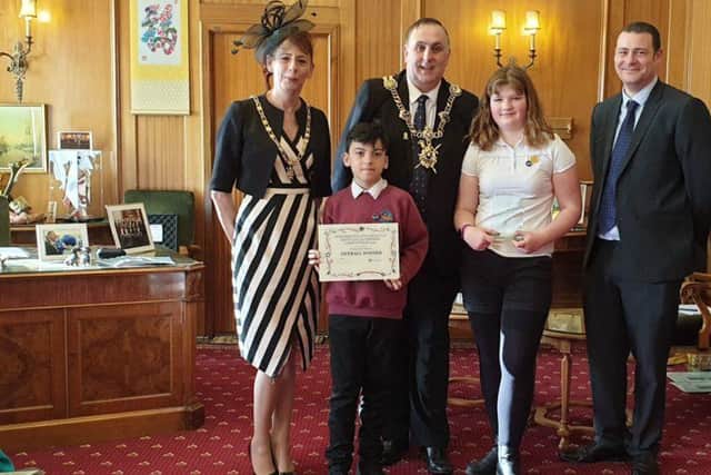 Main photo, (l-r): The Lady Mayoress, the Lord Mayor of Portsmouth, and Cllr Dave Ashmore, Portsmouth City Council's Cabinet Member for Environment and Community Safety, presenting the Recycling Superstars Award to winning pupils from Meon Junior School.