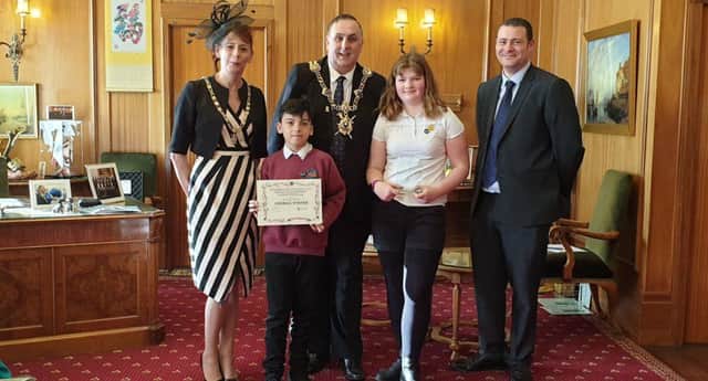 Main photo, (l-r): The Lady Mayoress, the Lord Mayor of Portsmouth,  and Cllr Dave Ashmore, Portsmouth City Council's Cabinet Member for Environment and Community Safety, presenting the Recycling Superstars Award to winning pupils  from Meon Junior School.