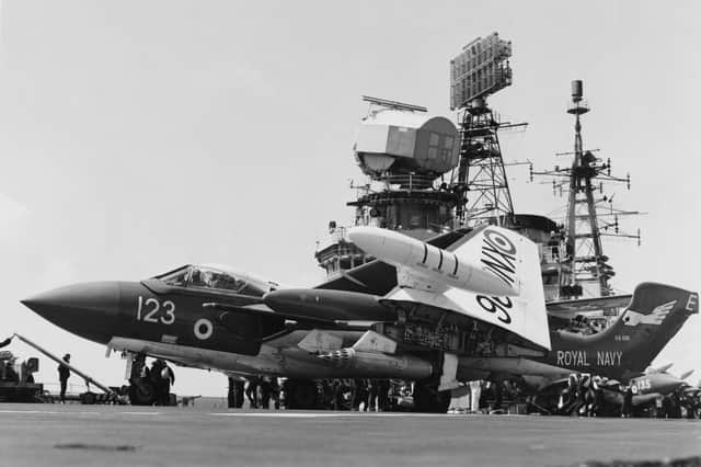 A Fleet Air Arm de Havilland DH 110 Sea Vixen, twin boom, twin-engined  two-seat jet fighter of 899 Naval Air Squadron on the flight deck of the Royal Navy Audacious-class fleet aircraft carrier HMS Eagle during exercises in the English Channel 3 June 1969 off Portsmouth, United Kingdom.  (Photo by Keystone/Hulton Archive/Getty Images).