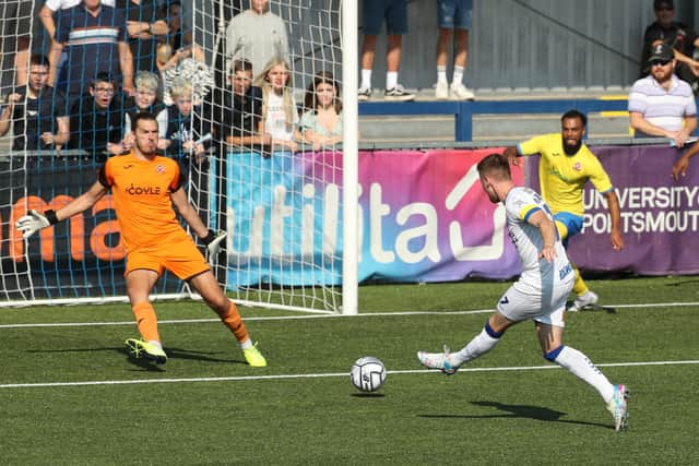 Jake McCarthy scores against Beaconsfield in the FA Cup. Picture by Dave Haines.