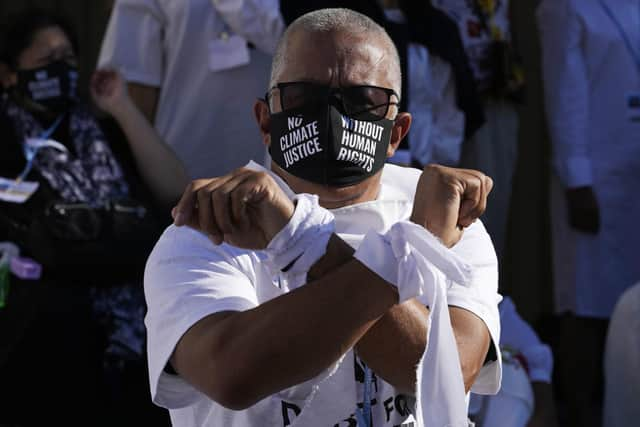 A demonstrator participates in a silent protest for climate justice and human rights at the COP27 U.N. Climate Summit, Thursday, Nov. 10, 2022, in Sharm el-Sheikh, Egypt. (AP Photo/Peter Dejong)