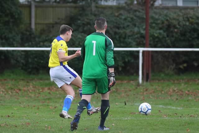 Kieran Hammond rolls into an empty net to fire Denmead in front. Picture: Stuart Martin (220421-7042)