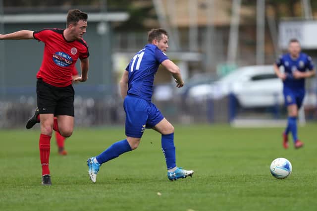 Miles Everett (blue) struck twice in the first half as Baffins Milton Rovers defeated a young Horndean side to reach the Portsmouth Senior Cup final. Picture: Chris Moorhouse.