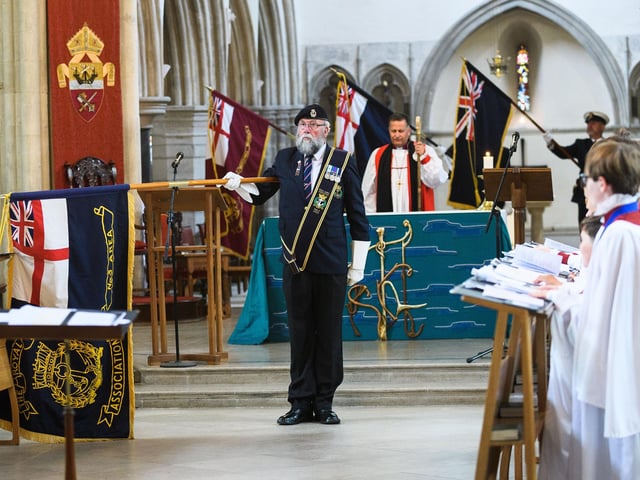 Pictured is: The Standards are lowered during the national anthem. Picture: Keith Woodland (190621-498)
