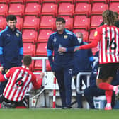 SUNDERLAND, ENGLAND - APRIL 02: Sunderland player Max Power celebrates in front of the Oxford bench after scoring the third Sunderland goal during the Sky Bet League One match between Sunderland and Oxford United at Stadium of Light on April 02, 2021 in Sunderland, England. Sporting stadiums around the UK remain under strict restrictions due to the Coronavirus Pandemic as Government social distancing laws prohibit fans inside venues resulting in games being played behind closed doors. (Photo by Stu Forster/Getty Images)