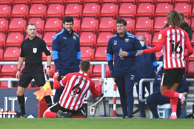 SUNDERLAND, ENGLAND - APRIL 02: Sunderland player Max Power celebrates in front of the Oxford bench after scoring the third Sunderland goal during the Sky Bet League One match between Sunderland and Oxford United at Stadium of Light on April 02, 2021 in Sunderland, England. Sporting stadiums around the UK remain under strict restrictions due to the Coronavirus Pandemic as Government social distancing laws prohibit fans inside venues resulting in games being played behind closed doors. (Photo by Stu Forster/Getty Images)
