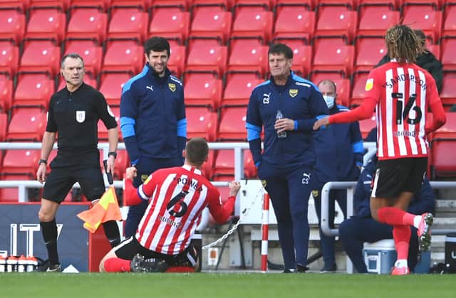 SUNDERLAND, ENGLAND - APRIL 02: Sunderland player Max Power celebrates in front of the Oxford bench after scoring the third Sunderland goal during the Sky Bet League One match between Sunderland and Oxford United at Stadium of Light on April 02, 2021 in Sunderland, England. Sporting stadiums around the UK remain under strict restrictions due to the Coronavirus Pandemic as Government social distancing laws prohibit fans inside venues resulting in games being played behind closed doors. (Photo by Stu Forster/Getty Images)
