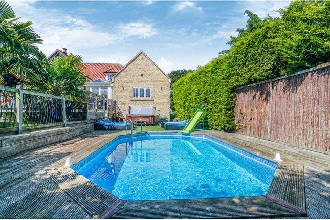 As well as this stylish pool deck, this five-bedroom house also has a tennis court and cinema room. Price: £1.12 million