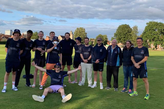 Champions - Hambledon celebrate with the Southern Premier League Division 3 silverware.