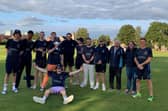 Champions - Hambledon celebrate with the Southern Premier League Division 3 silverware.