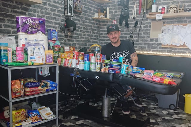 Gosport tattoo artist Steve Lowry is turning his studio into an independent food bank for people who need it during lockdown. Pictured: Steve with some of the donations from his clients