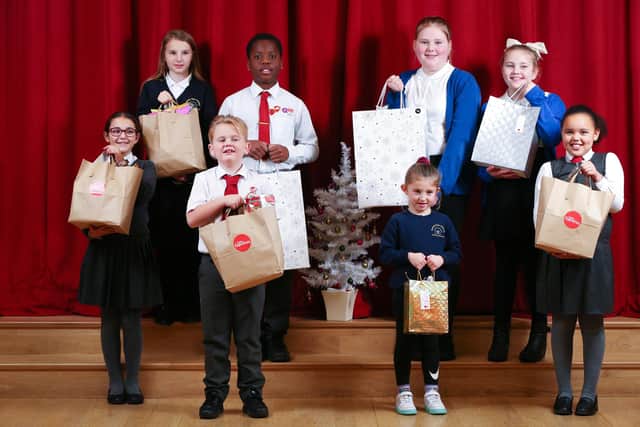 From left, Elizabetta, 10, Alicia, 10, Teddy, 7, Mark, 10, Freya, 10, Nellie, 5, Betty, 8 and Isabelle, 7 with their kindness bags. Picture: Chris Moorhouse (jpns 071221-20)