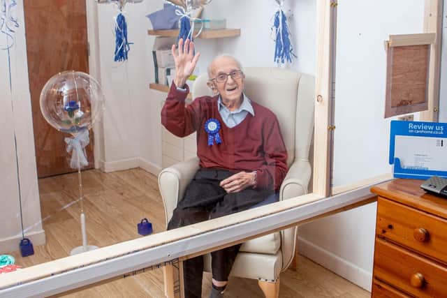 Bob Phillips is celebrating his 106th birthday today at The Haven care home, and will receive his second Pfizer jab on the same day
Pictured: Bob Phillips in a Visiting Pod at The Haven care home, Drayton, Portsmouth on 17 March 2021.
Picture: Habibur Rahman