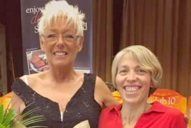 Sally Hurley, right, receiving her award from Slimming World consultant Linda Richards.