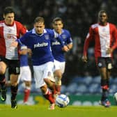 Former Pompey skipper Brian Howard drives forward against Crawley in December 2012. Picture: Ian Hargreaves