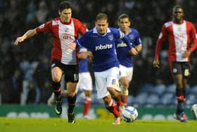 Former Pompey skipper Brian Howard drives forward against Crawley in December 2012. Picture: Ian Hargreaves