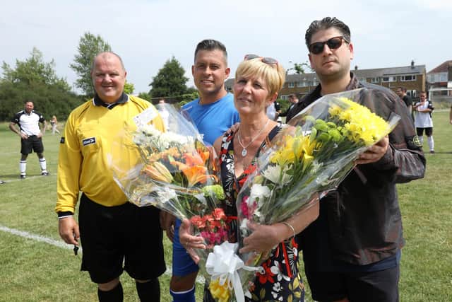 Flowers for David's mother, Debbie at the fundraising match in 2019 Picture: Chris Moorhouse     (040819-44)