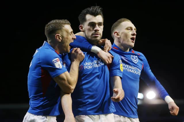John Marquis, centre, celebrates scoring against MK Dons in February