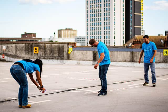 The Portsmouth Film Society team marking out social distancing guidelines for cars. Picture: Steven Mead and PFS.