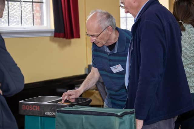 Volunteers gathered to fix some of the more complicated items.
Picture: Alex Shute